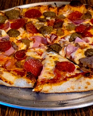 meat met meat meat met meat pizza made by Soul Fly Pizza Co in St. Anthony, ID